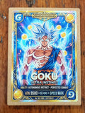 A Dragon Ball Z 'Goku Ultra Instinct' trading card, Edition 01, displayed flat on a wooden surface. The card features Goku in his Super Saiyan form with blue hair and a blue cape, surrounded by blue energy effects and yellow Dragon Balls.