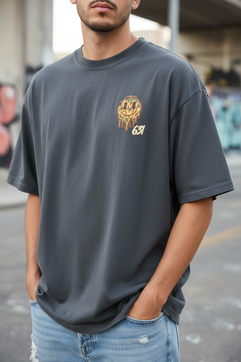 Close-up lifestyle shot of 631 Oversized Drip Faded Tee showing boxy oversized fit and vintage faded texture