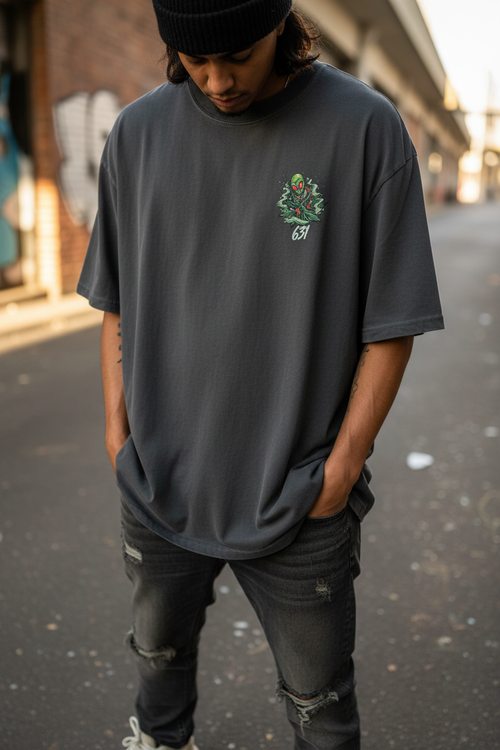 Close-up lifestyle shot of 631 Alien Haze Oversized Faded Tee showing boxy oversized fit and vintage faded texture
