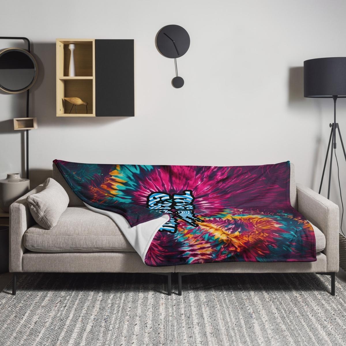 gallery throw blanket draped over sofa, adding cozy style and vibrant decor accent to living room