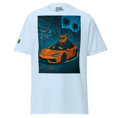 White t-shirt with a graphic of a dog driving an orange car on a blue street scene.