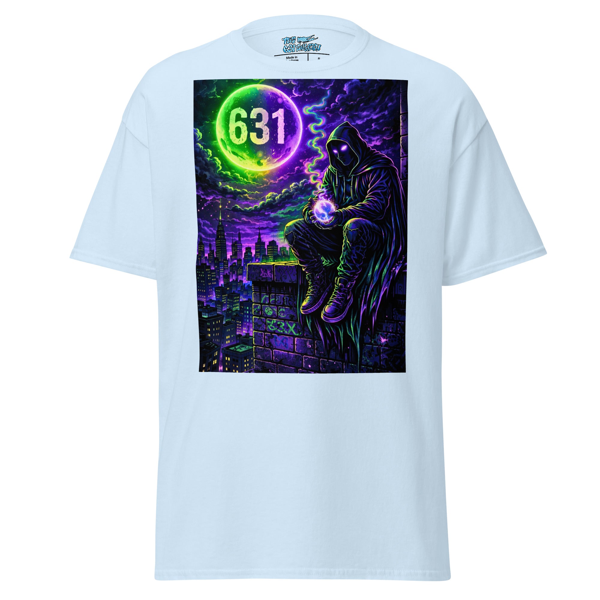 A light blue short-sleeve t-shirt with a large, vibrant graphic print on the front. The graphic features a hooded figure sitting on a rooftop under a purple night sky, holding a glowing orb with the number '631' inside a neon green ring.