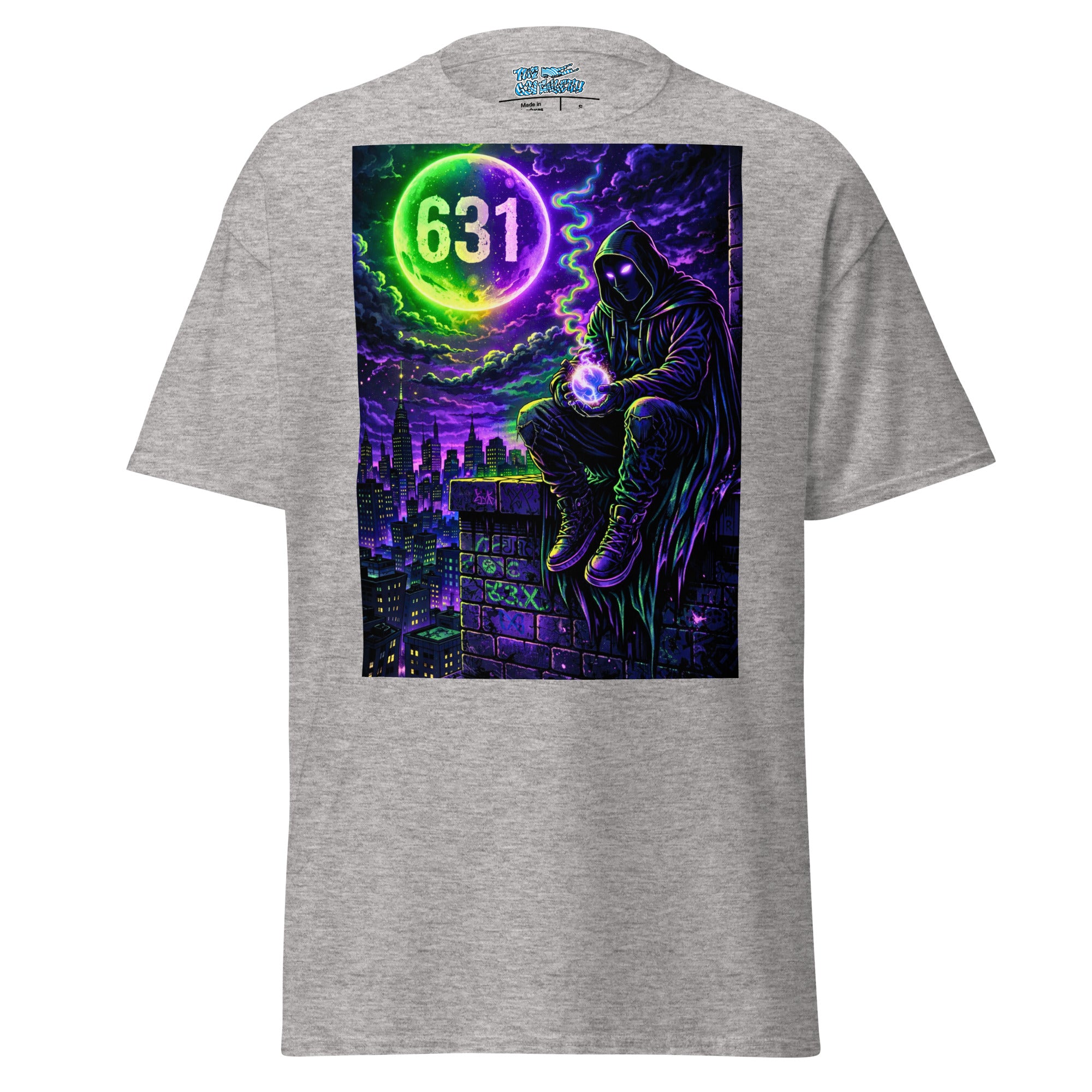 A heather gray short-sleeve t-shirt with a large rectangular graphic print on the back. The graphic features a dark hooded figure sitting on a rooftop at night under a purple and black stormy sky, with a glowing green neon moon containing the number '631'.